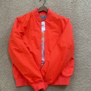Orange Michael Korda lightweight spring jacket.